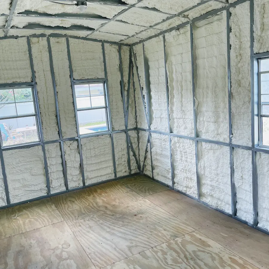 Closed-cell spray foam insulation applied to wall cavities in a residential project in Rincon